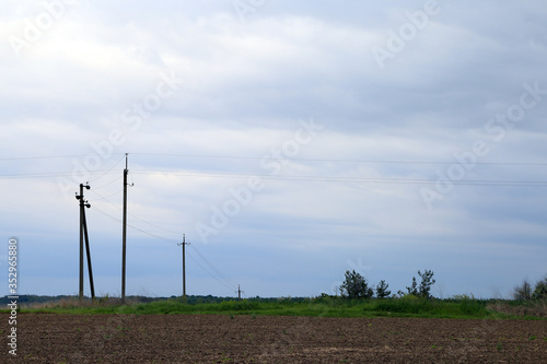 Spring landscape of field, sky and clouds
