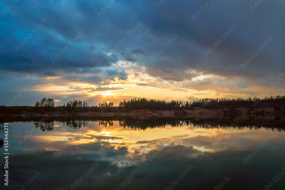 Spring sunset over the lake in calm weather . Vsevolozhsk. Leningrad region .