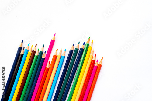 Colour pencils isolated on white background close up. Pencils are tilted to the side.