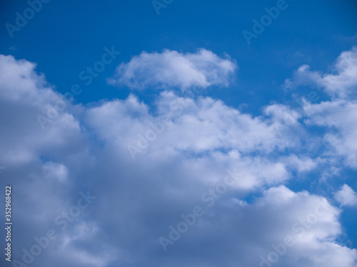 Beautiful blue sky with white and fluffy clouds