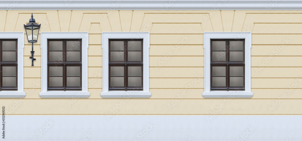 Social Distancing Abstract Concept, Old European Street with Pastel Yellow Wall and Windows Social Distancing Abstract Concept, Old European Street with Pastel Yellow Wall and Windows