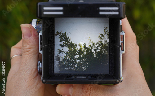 landscape through the viewfinder of the vintage TLR (Twin lens reflex) camera. photo