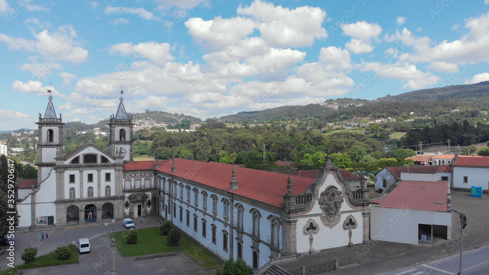 Aerial view of the Monastery of St. Benedict (Sao Bento) in the city of Santo Tirso, Portugal, with the Ave River in the background. Benedictine order. Aerial view of the Monastery of St. Benedict (Sao Bento) in the city of Santo Tirso, Portugal, with the Ave River in the background. Benedictine order.