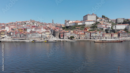Colorful houses of Porto Ribeira, traditional facades, old multi-colored houses with red roof tiles on the embankment in the city of Porto, Portugal. Unesco World Heritage.