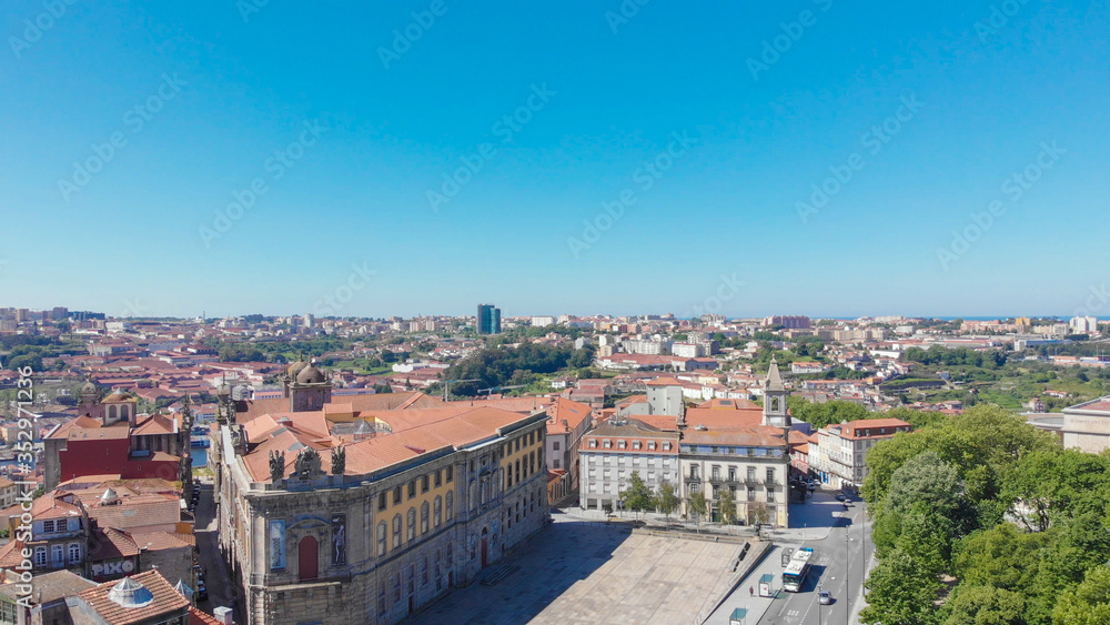 Aerial view of buildings with red tile roofs in the Porto city center, Portugal. The Portuguese Centre of Photography building.