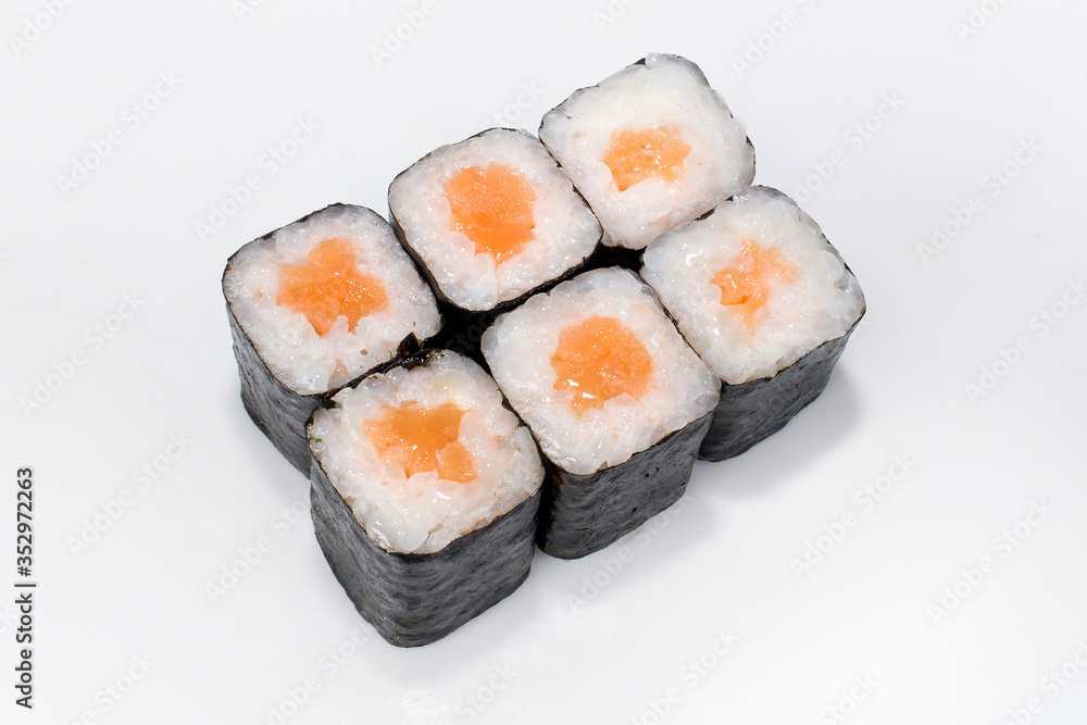 Japanese traditional roll with rice, nori and salmon on a white background Japanese traditional roll with rice, nori and salmon on a white background