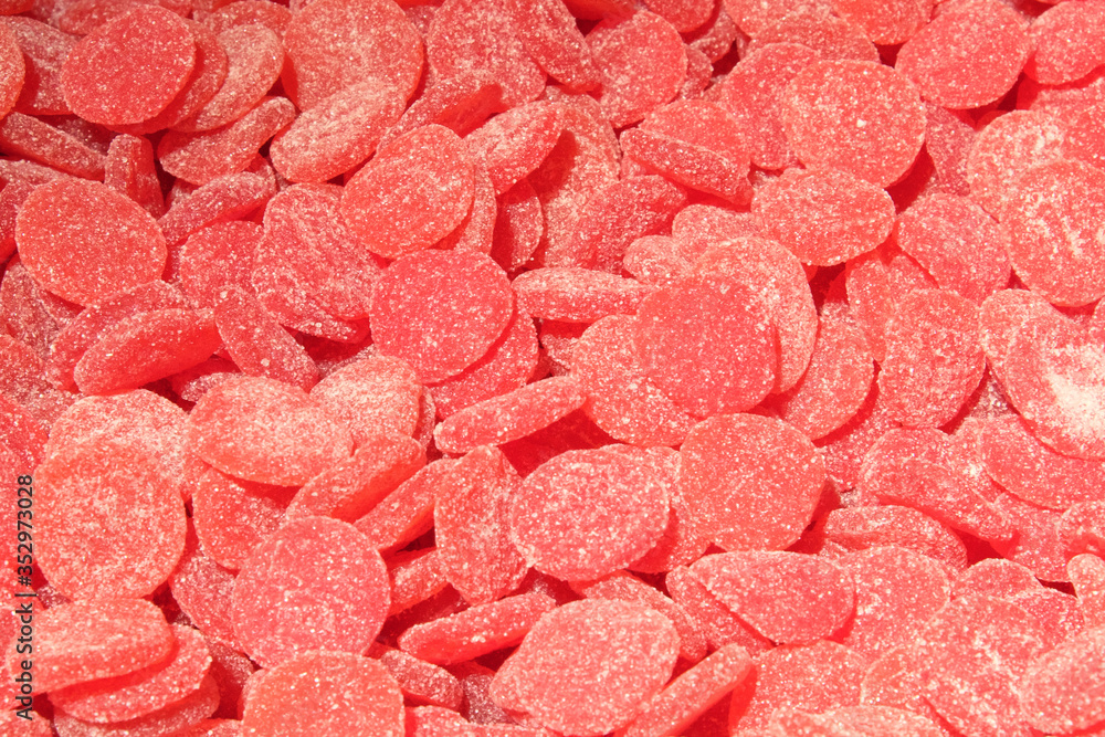 A pile of pink marmalade as a background. Candy close-up. A pile of pink marmalade as a background. Candy close-up.