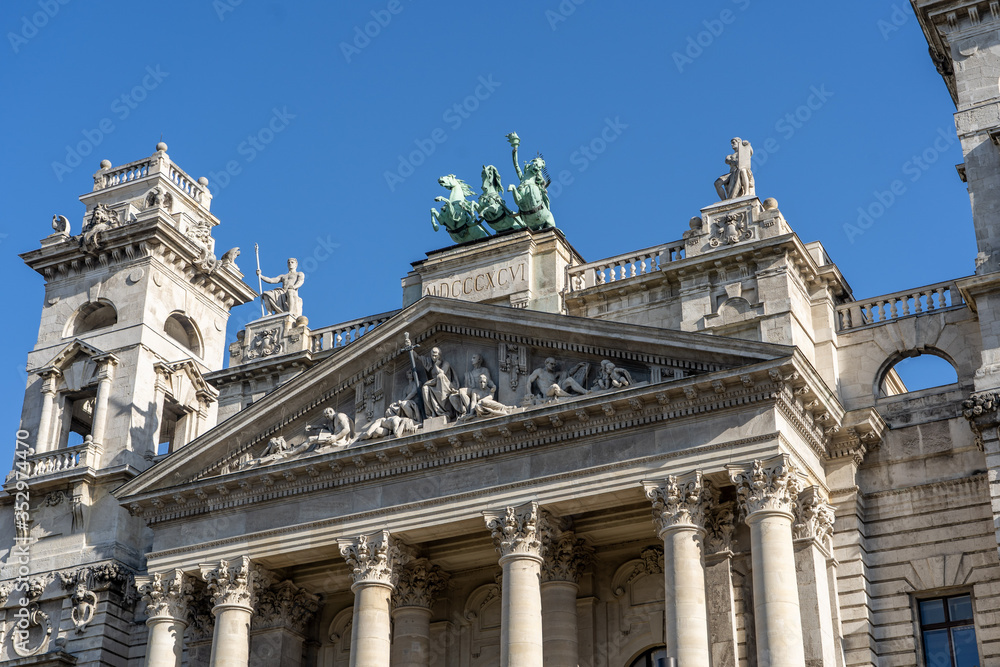 Neo Renaissance main facade with court trial sculptures on tympanum field of Museum of Ethnography in Budapest
