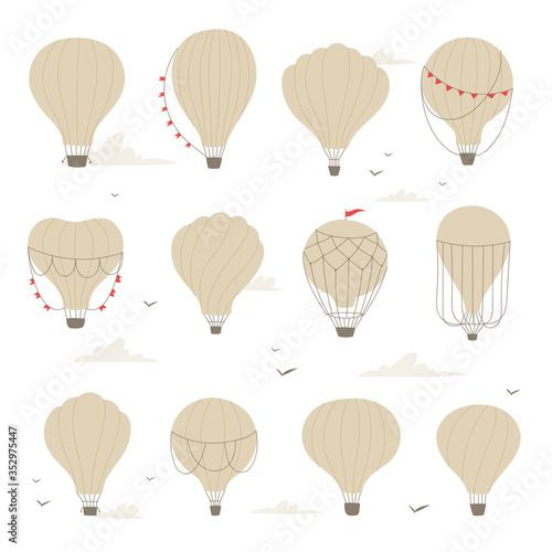 Colorful set of hot air balloons or aerostat with basket in different shapes flying in sky with clouds. Vector illustration of traveling flying toy for poster, wallpapers, cards