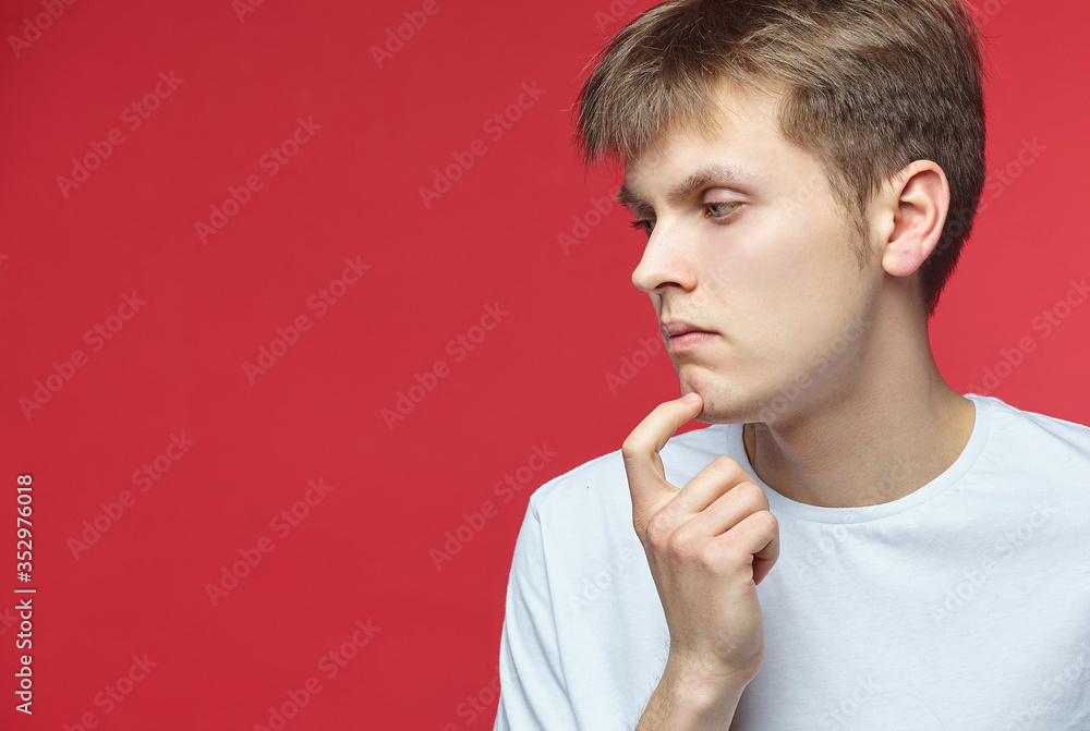 The young guy shows various emotions. Talented portrays the inner state and mood. Advertisement concept The young guy shows various emotions. Talented portrays the inner state and mood. Advertisement concept