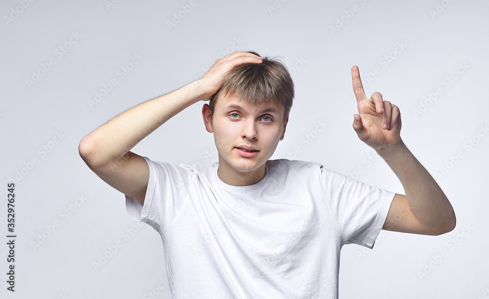The young guy shows various emotions. Talented portrays the inner state and mood. Advertisement concept The young guy shows various emotions. Talented portrays the inner state and mood. Advertisement concept
