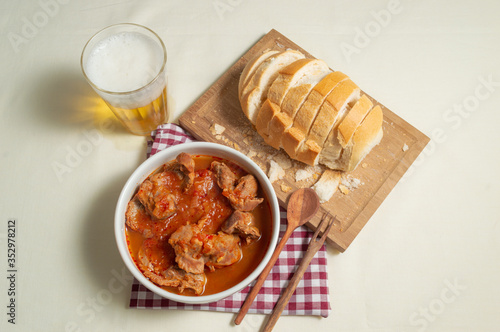 tasty and tradicional brazilian snack bar: gizzard, bread and cold beer. photo