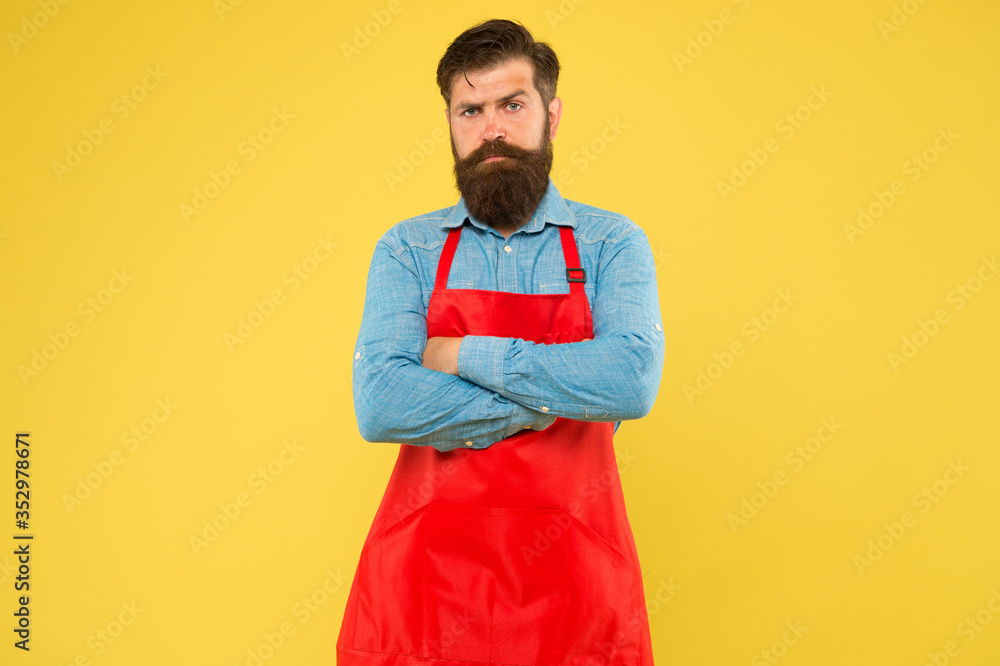 Restaurant cuisine. restaurant staff wanted. cooking is his hobby. bearded man in uniform. confident male housekeeper. Small business shop owner. mature shop assistant. professional chef in red apron Restaurant cuisine. restaurant staff wanted. cooking is his hobby. bearded man in uniform. confident male housekeeper. Small business shop owner. mature shop assistant. professional chef in red apron