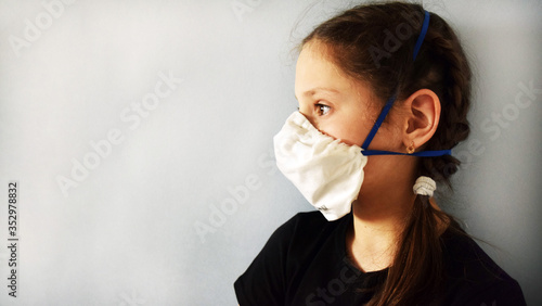 Beautiful girl in a medical mask against bacteria and viruses.