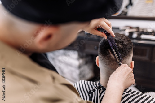 Men s beauty salon. Men s haircut in a barbershop. 