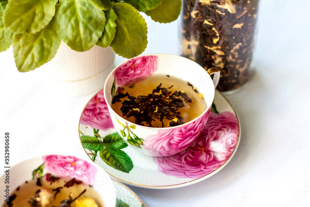Cup of tea. Large tea leaves in a Cup. A can of tea. Large-leaf tea with fruit. Cup of tea. Large tea leaves in a Cup. A can of tea. Large-leaf tea with fruit.
