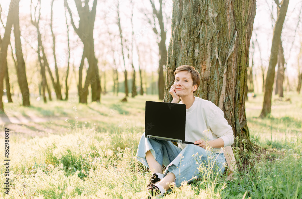 summer vacation park grass woman laptop communication summer vacation park grass woman laptop communication