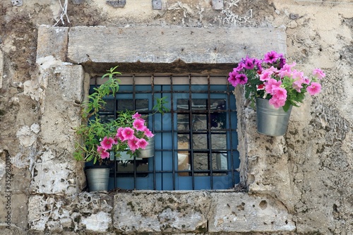 Tiny small little Italian window blue frame stone pink flowers flower vases deco decoration outdoors decor