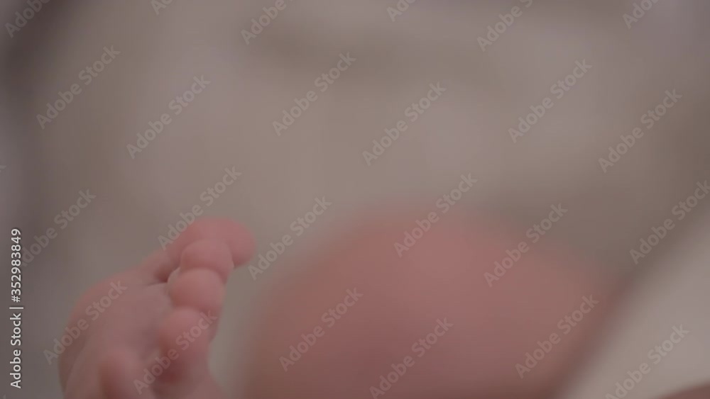 Newborn baby, leg large depth of field closeup Newborn baby, leg large depth of field closeup