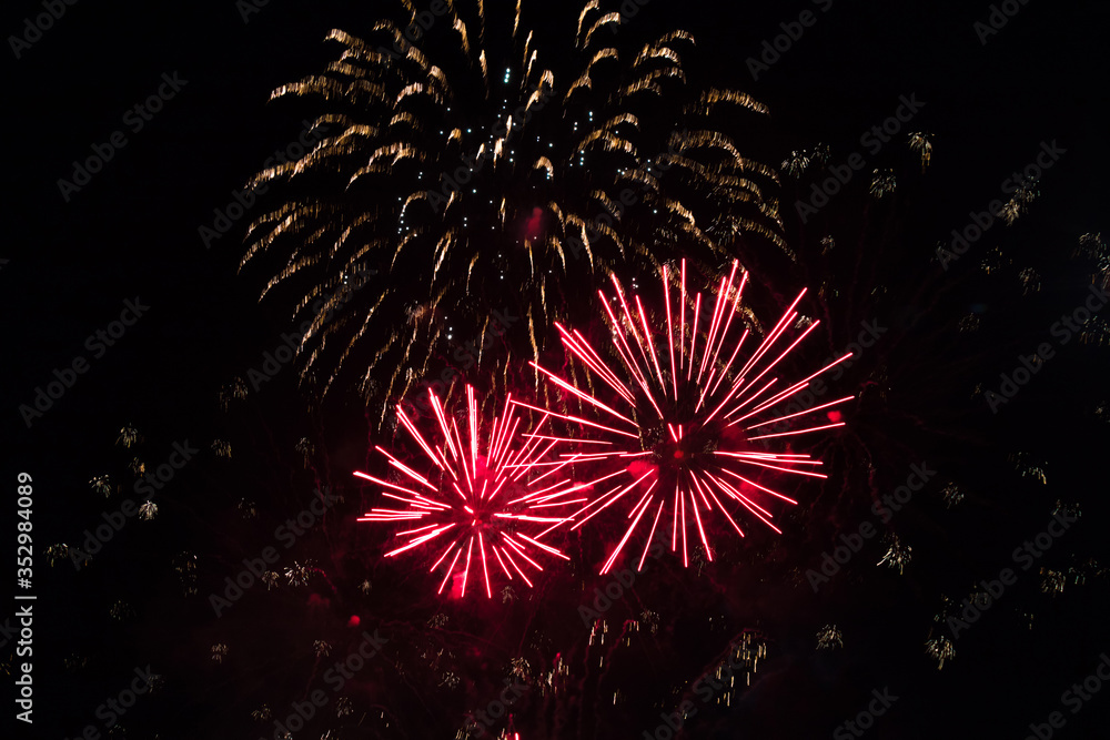 Fototapeta premium Beautiful Holiday background with red fireworks.