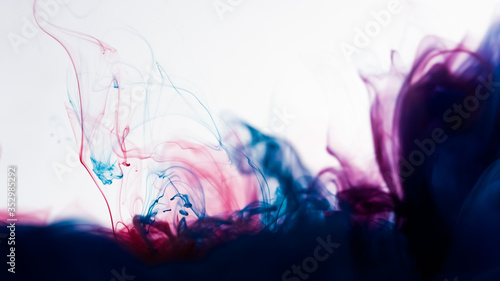 Cloud of color ink in water isolated on white. Abstract design and texture.
