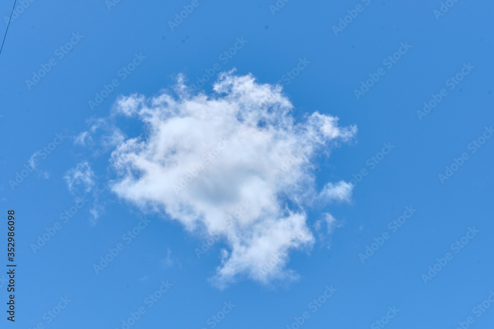 A lonely cloud of white on a blue clear sky A lonely cloud of white on a blue clear sky