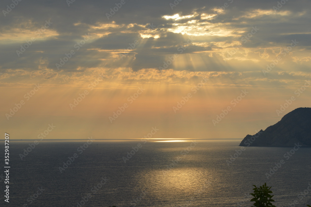 Sunset over the sea in Corniglia, Cinque Terre, Italy.