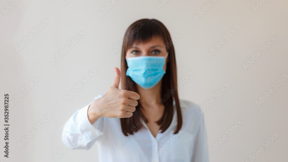 Caucasian young woman with respiratory mask approving protective mask for prevent infection. Medical concept protection from outbreak Covid 19 virus, cold, flu, respiratory disease Caucasian young woman with respiratory mask approving protective mask for prevent infection. Medical concept protection from outbreak Covid 19 virus, cold, flu, respiratory disease