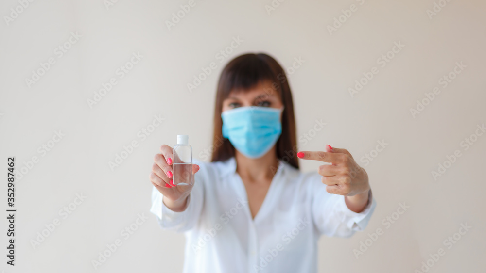 Caucasian young woman wearing protective respiratory mask using alcohol antiseptic gel for prevent infection. Medical concept protection from outbreak Covid 19 virus, cold, flu, respiratory disease.