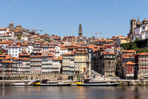 Colorful houses of Porto Ribeira  traditional facades  old multi-colored houses with red roof tiles on the embankment in the city of Porto  Portugal. Unesco World Heritage.