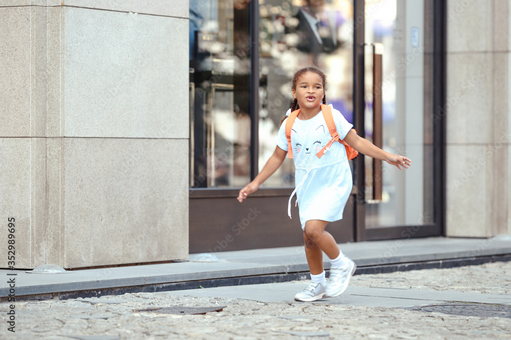 Funny little girl having fun in the city. Funny little girl having fun in the city.