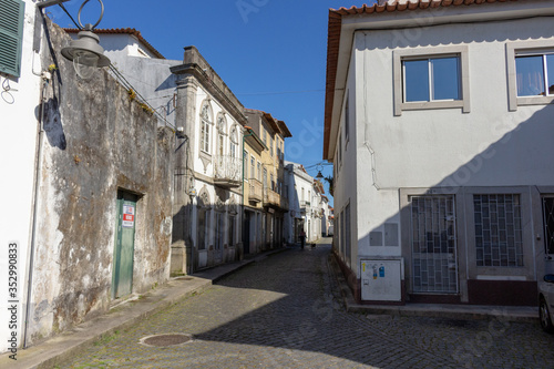 Located on the Cávado River’s left bank, the typical village of Fao is characterized by a marked neighborhood spirit. The narrow Azevedo Coutinho Street, Fao, Esposende, Portugal. photo