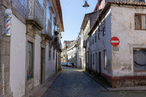Located on the Cávado River’s left bank, the typical village of Fao is characterized by a marked neighborhood spirit. The narrow Azevedo Coutinho Street, Fao, Esposende, Portugal.