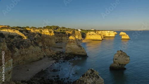 Time lapse movie of sunrise over the Praia de Marinha beach