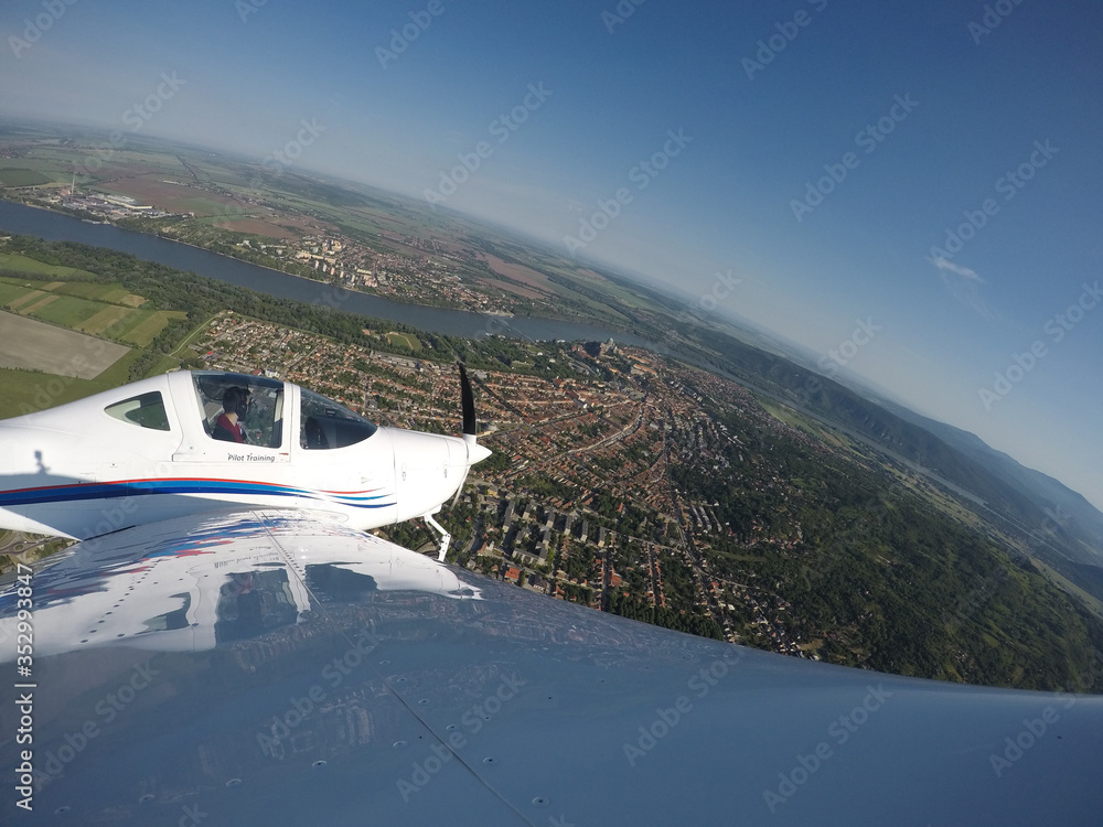 Fototapeta premium Solo training flight over Esztergom Hungary. Slovakia is across the Danube River.