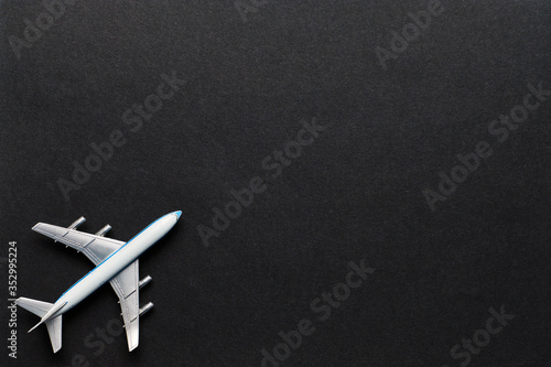 Airplane on a black background with copy space