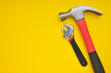 Two tools on yellow background