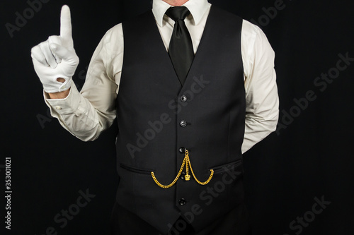 Portrait of Butler Wearing Clean White Gloves With Finger Raised. Concept of Service Industry and Professional Hospitality. Dependable Servant. Copy Space for Service.