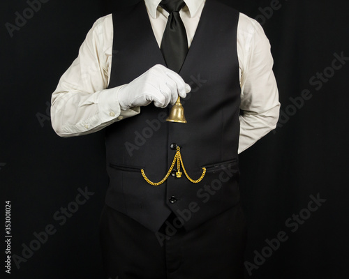 Portrait of Butler in White Gloves Holding Brass Bell. Concept of Service Industry and Professional Hospitality. Dependable Servant. Copy Space for Service.