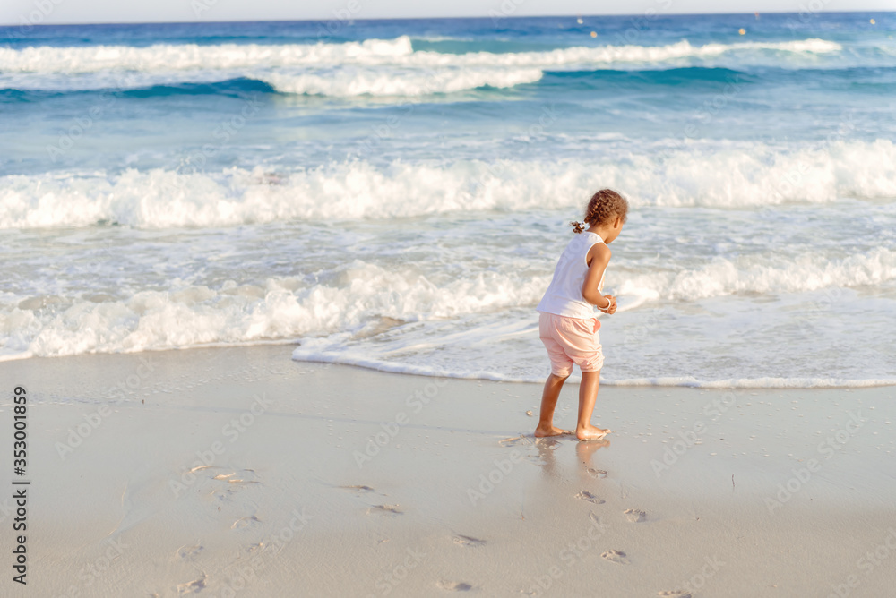 happy little girl have fun and joy time at beautiful beach happy little girl have fun and joy time at beautiful beach