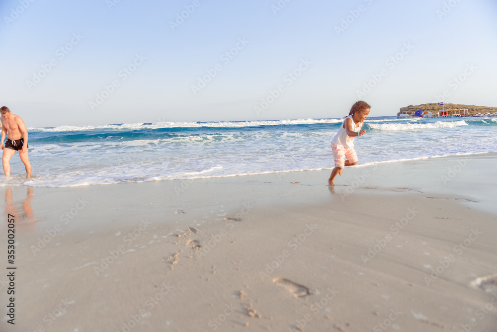 happy little girl have fun and joy time at beautiful beach happy little girl have fun and joy time at beautiful beach