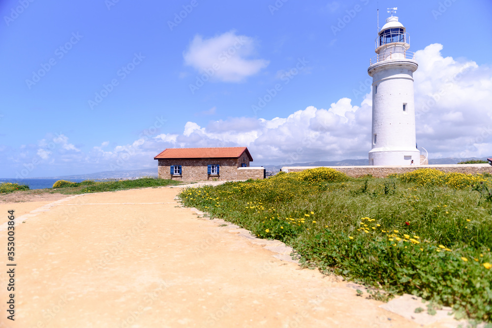 Lighthouse white against the blue sky. Symbol of hope and faith in the future