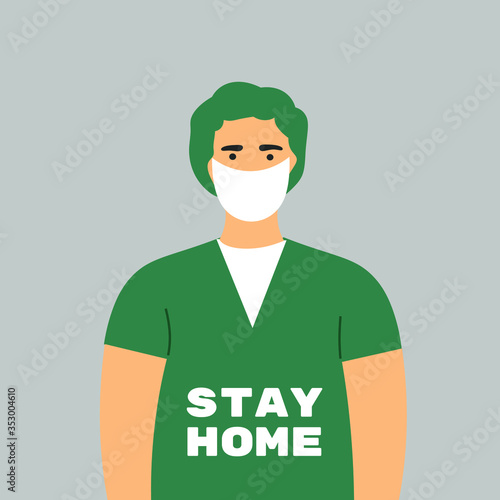 Prevention of Coronavirus, Covid-19. A tired doctor in a face mask with "Stay home" written on his uniform.