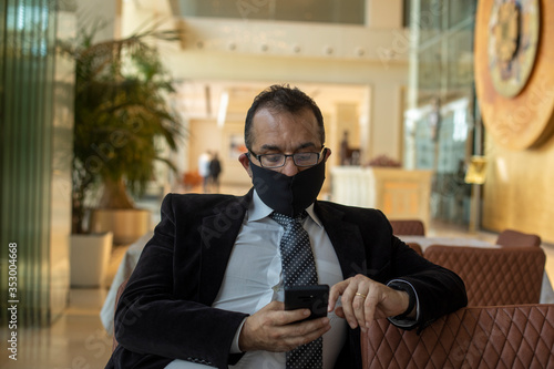 young businessman with mask in the restaurant