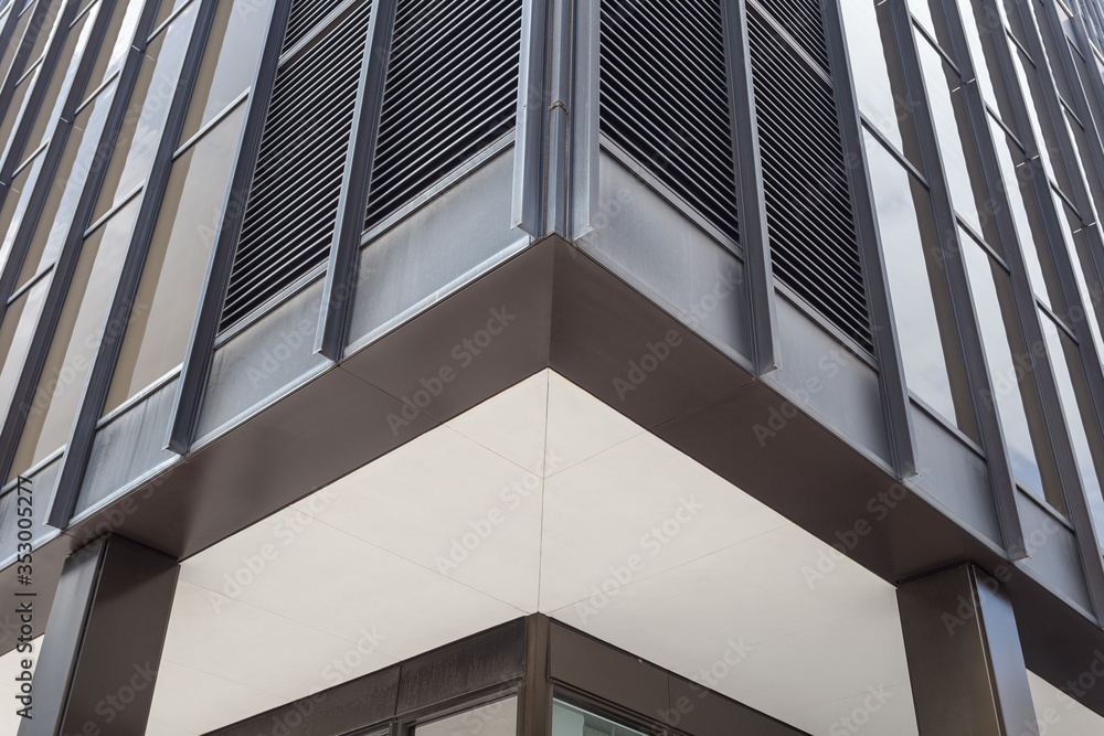 Close up of a generic black office building in a plain urban downtown Close up of a generic black office building in a plain urban downtown
