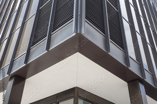 Close up of a generic black office building in a plain urban downtown © Richard