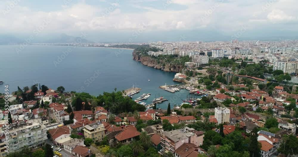 Aerial panoramic view of the Antalya city. Mediterranean sea, and the coast of Antalya. Old town Kaleici, Yacht Marina, mountains and sky in the background. Aerial drone shooting. TURKEY Aerial panoramic view of the Antalya city. Mediterranean sea, and the coast of Antalya. Old town Kaleici, Yacht Marina, mountains and sky in the background. Aerial drone shooting. TURKEY