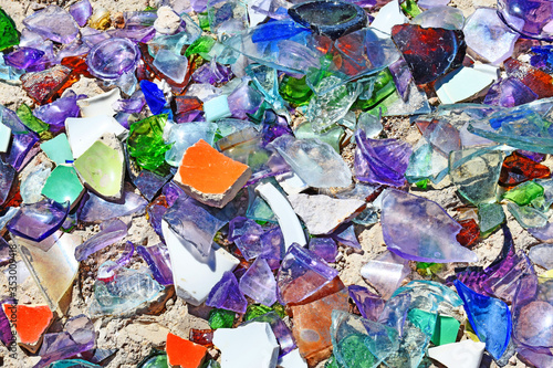 background of broken glass, colorful pieces on the groung