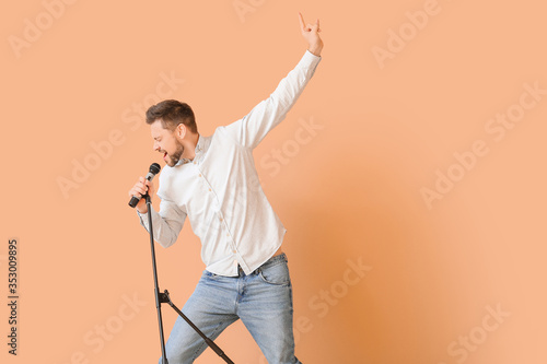 Handsome man singing agains...