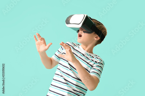 Cute little boy with VR gla...